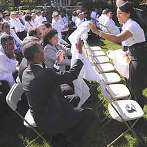 OOPS! A crowd of 150 doctors gathers in the Rose Garden to support the health-care overhaul -- as White House staffers scramble to hand out camera-ready white coats to those who forgot their own. EPA NYPost